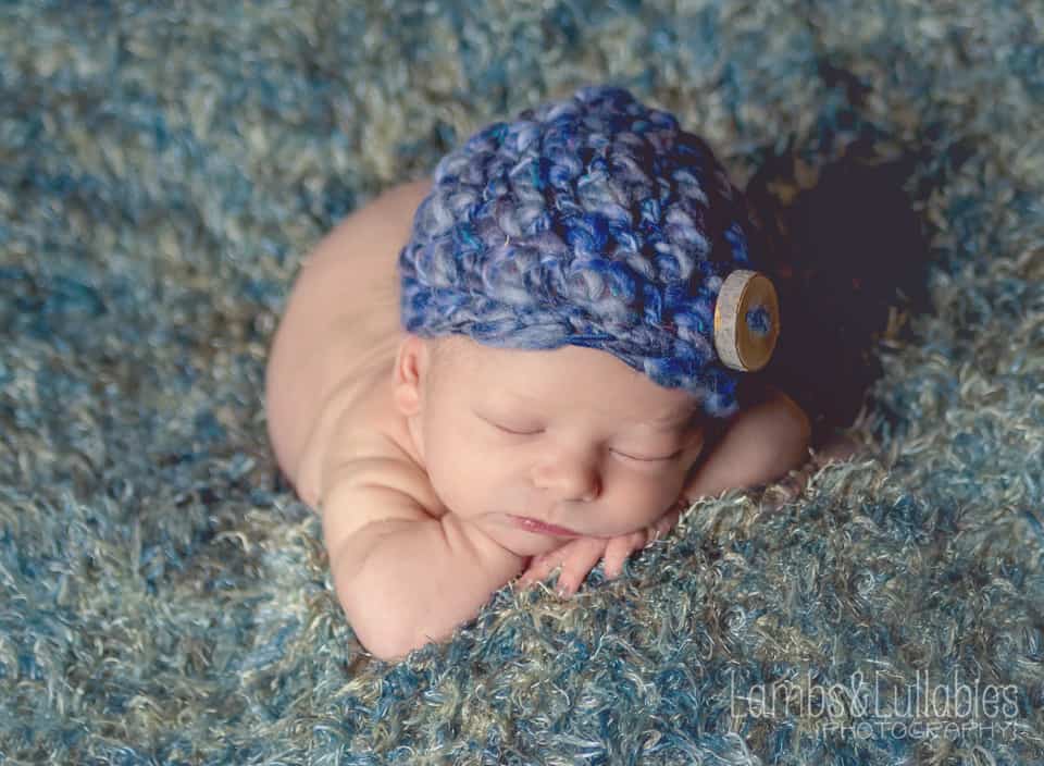 newborn in blue hat