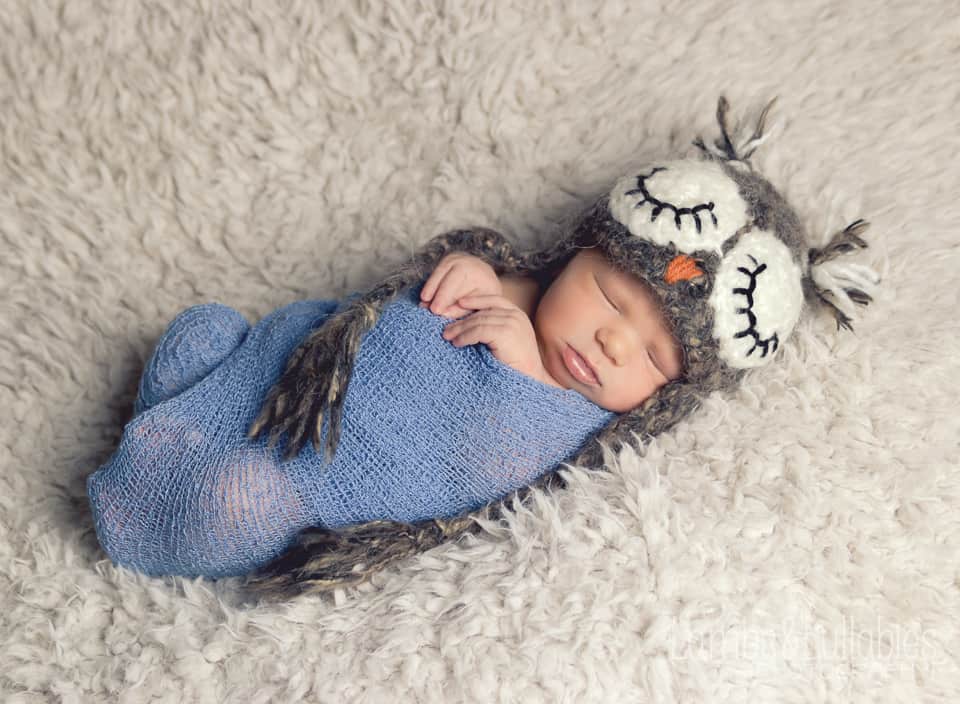 Newborn in an owl hat