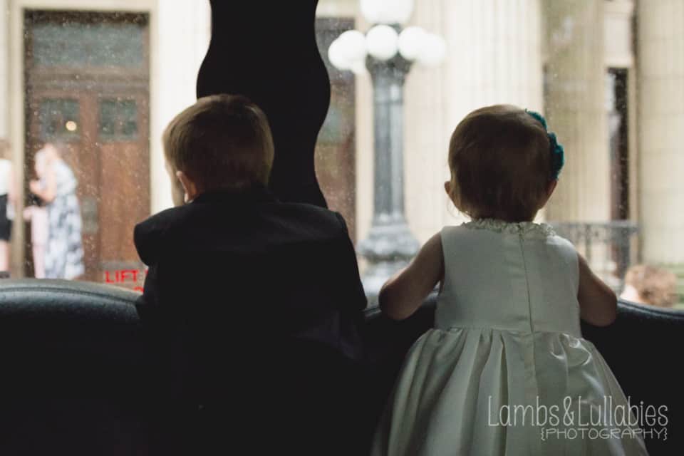 toddlers looking out window