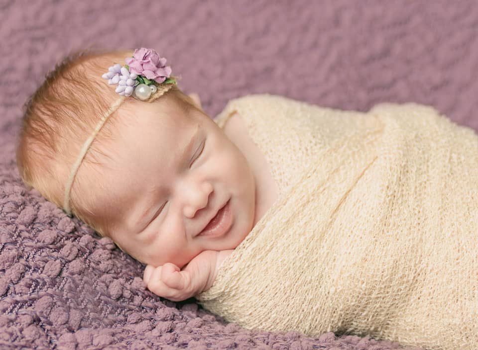 smiling newborn girl