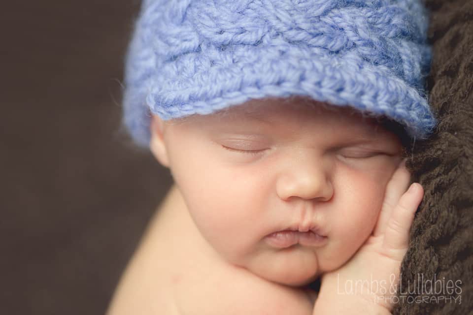 newborn baby boy in blue hat