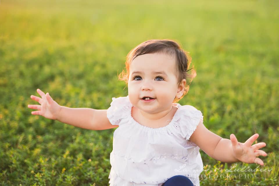 smiling baby girl outside