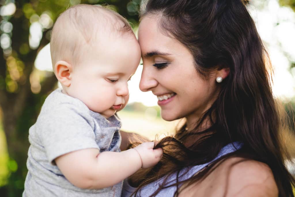 Mother and baby son looking at each other