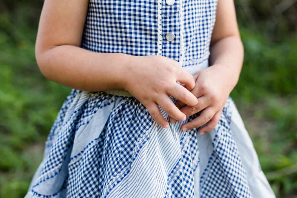 Little girl hands crossed detail picture