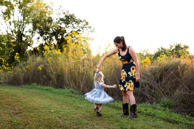 Mom twirls daughter in family pictures