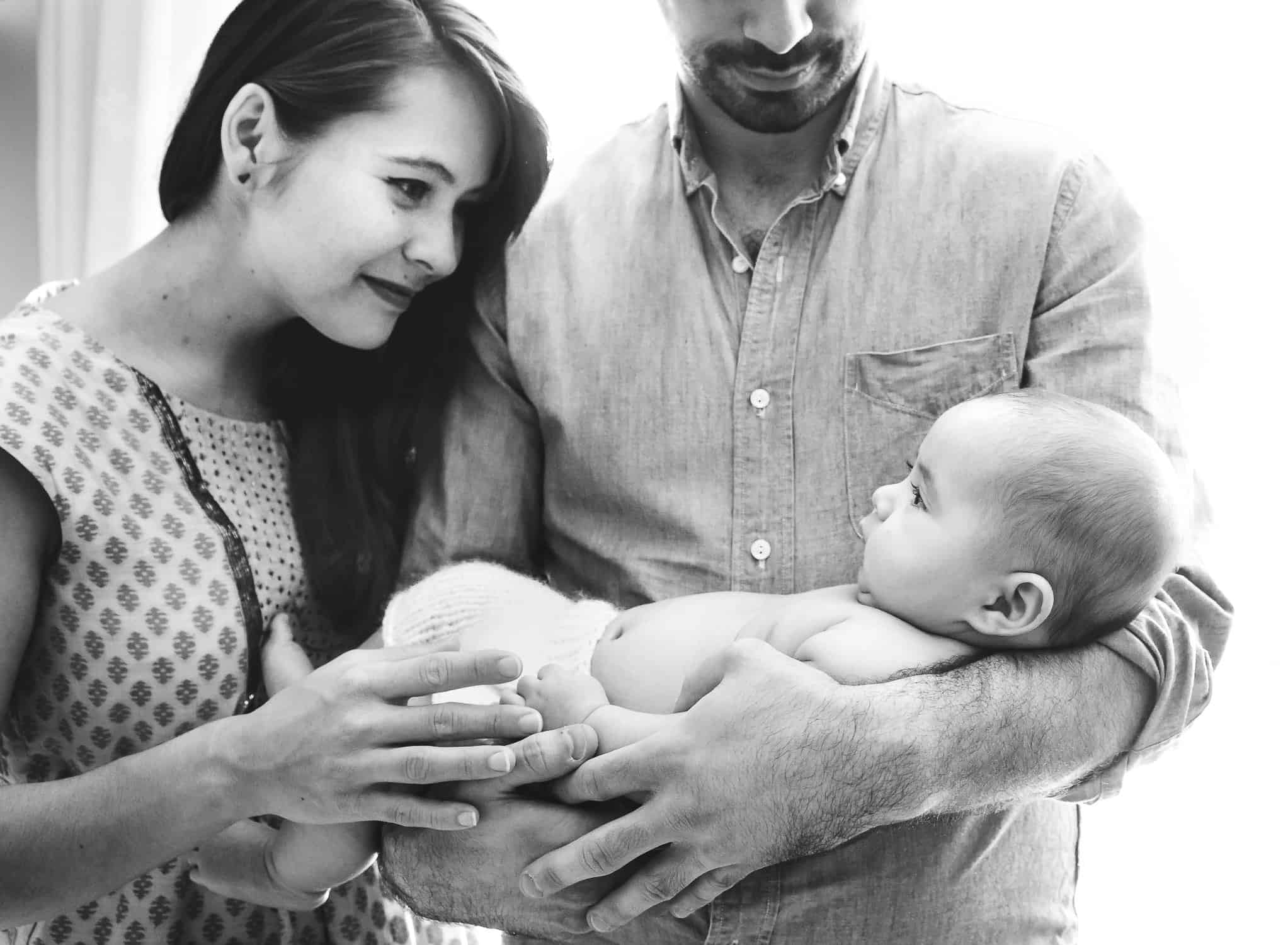 Mom and 3 month old baby boy looking at each other in black and white picture