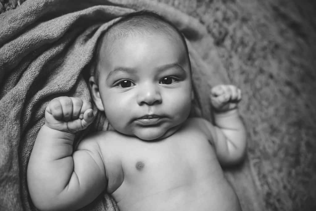 3 month baby looking intensely into the camera black and white picture