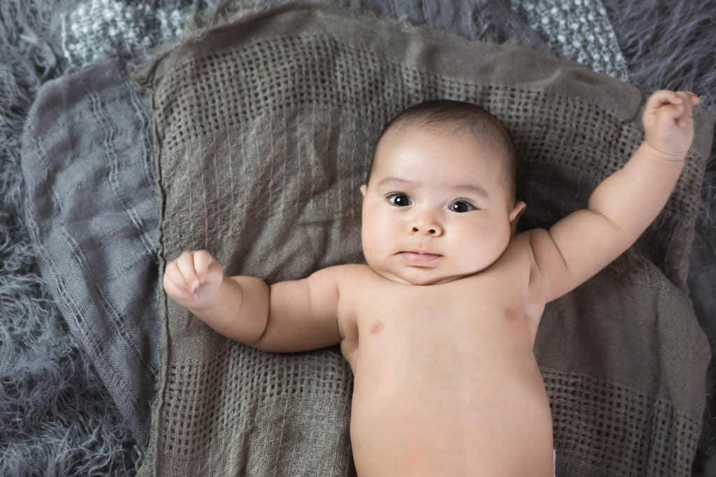 Kansas city baby milestone session at 3 months baby boy looking at camera